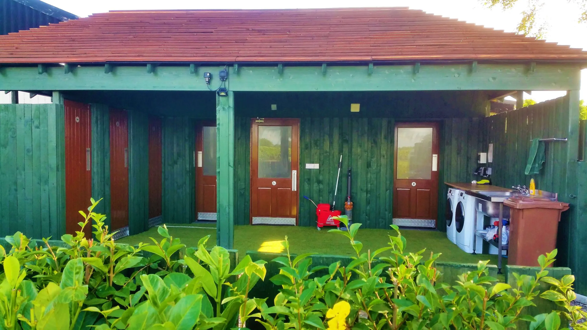 The amenities block with washing machine area